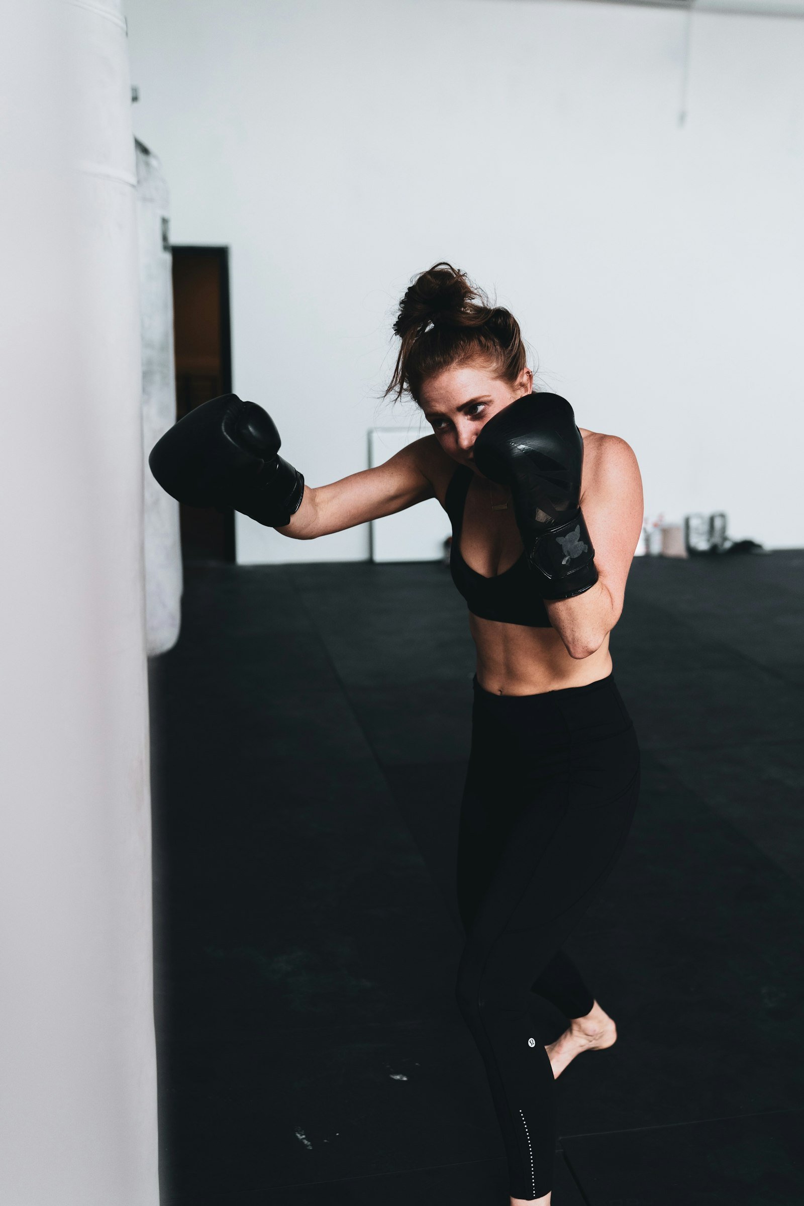 Athlete in boxing gloves, guard up