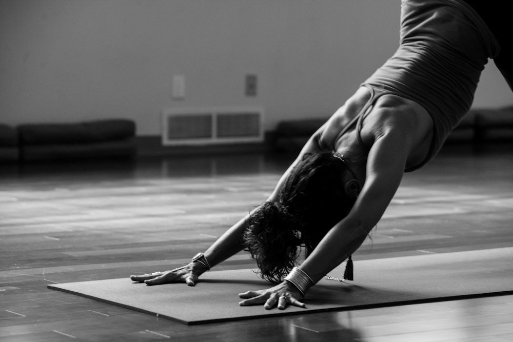 Person stretching on a studio floor